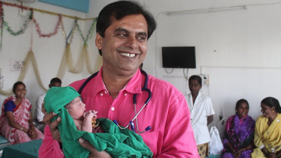 Dr Ganesh Rakh with a baby girl