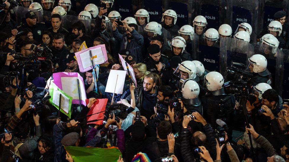 Demonstrators scuffle with riot police during a protest against femicide and violence against women on 25 November, 2019 in Istanbul, Turkey.