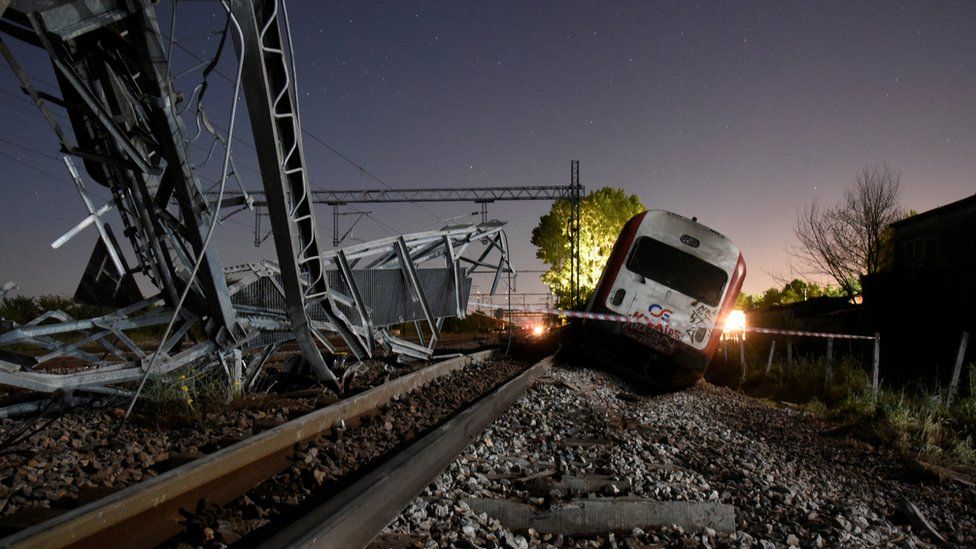 A derailed train carriage is seen toppled in the town of Adendro in northern Greece, 13 May 2017