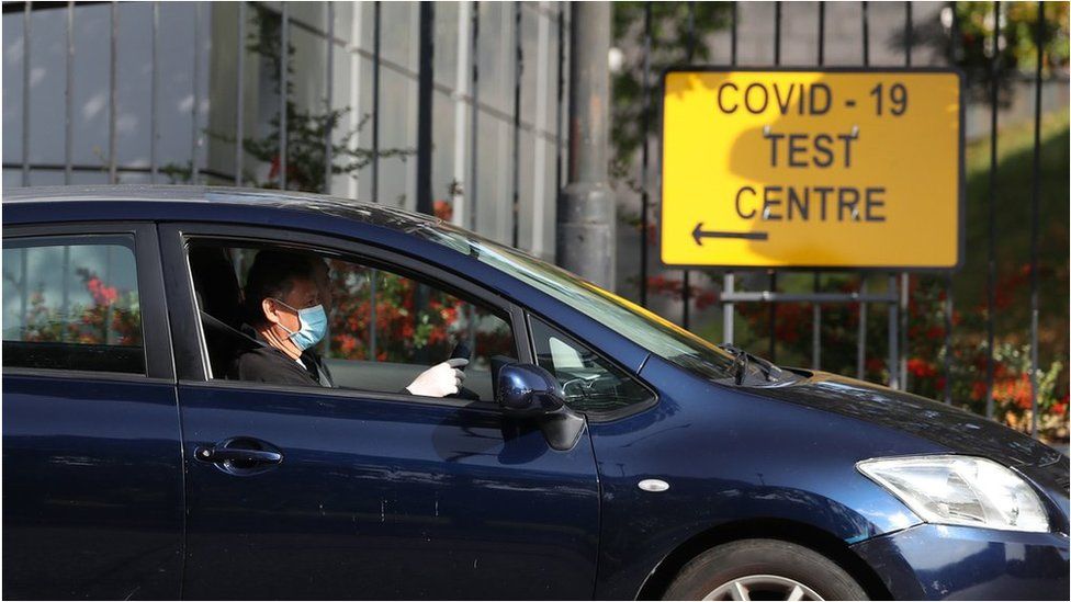 A car drives past a testing centre