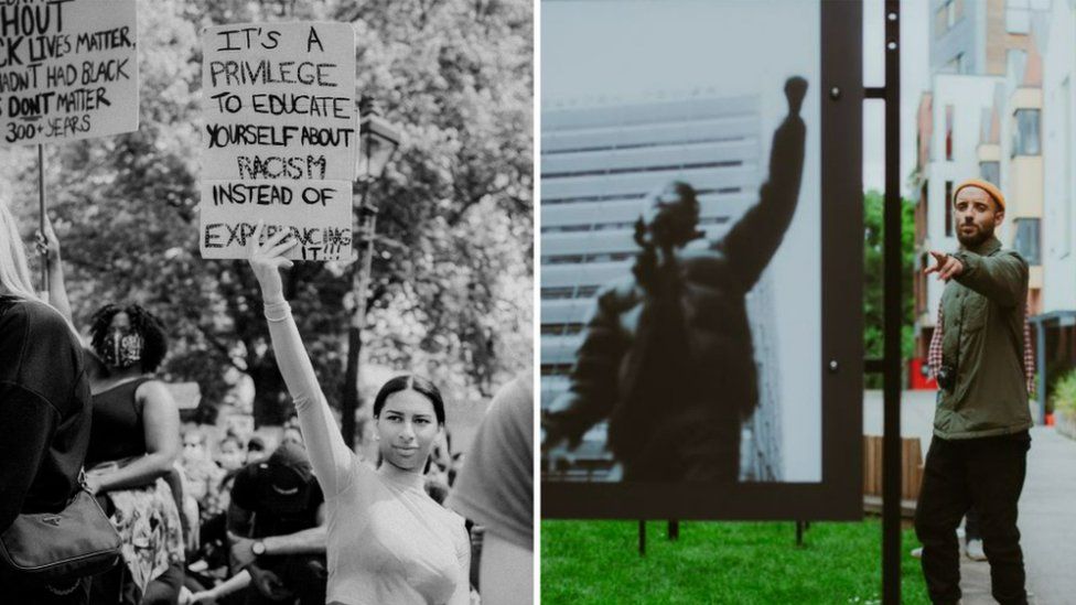 Woman holding placard and Khali Ackford standing next to one of his images