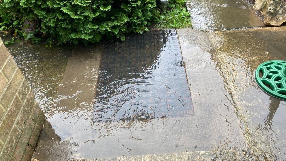 Flooded manhole in Mr Barber's garden