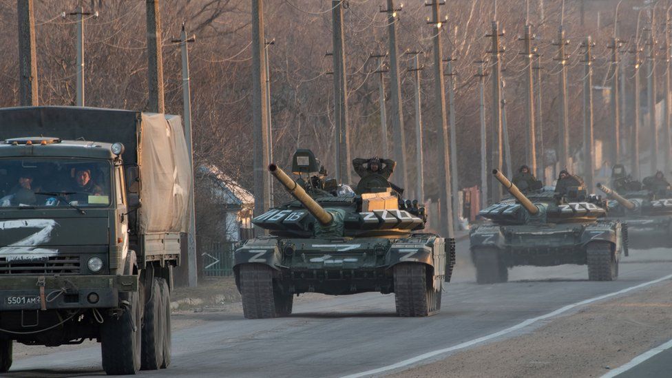 A column of tanks marked with the Z symbol stretches into the distance as they proceed northwards along the Mariupol-Donetsk highway in March.