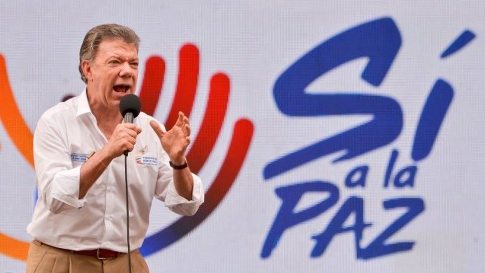 This file photo taken on July 29, 2016 shows Colombian President Juan Manuel Santos speaking to the audience during the first day of the campaign "Pedagogy for Peace" to inform people about the peace talks between the government and the Farc guerrillas, in Cali, Colombia