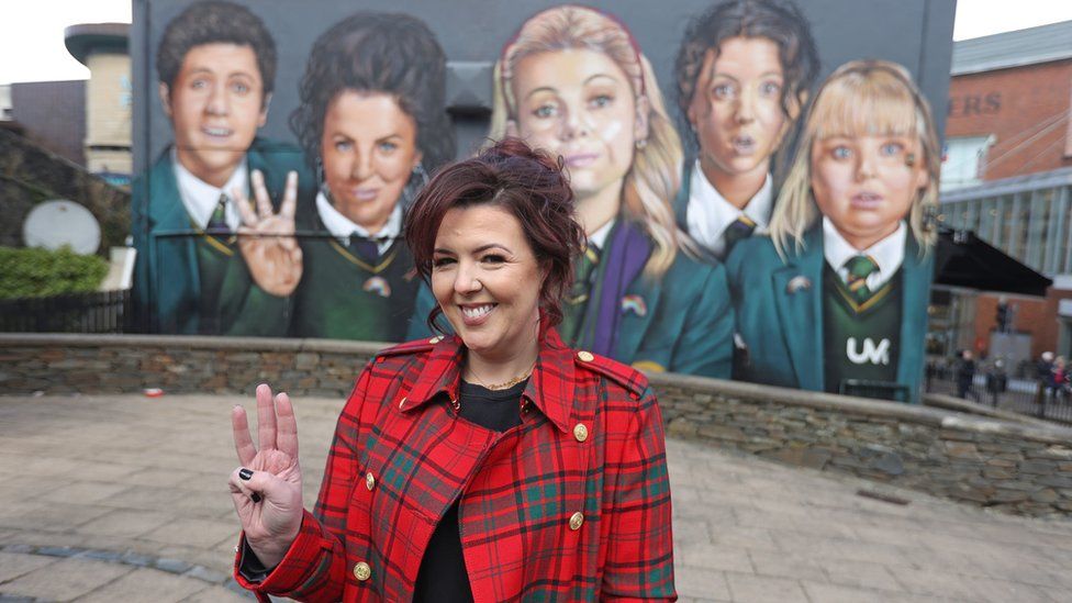 Writer Lisa McGee in front of a Derry Girls mural in Londonderry, ahead of the premiere for the third series of Channel 4"s Derry Girls at the Omniplex Cinema in Londonderry