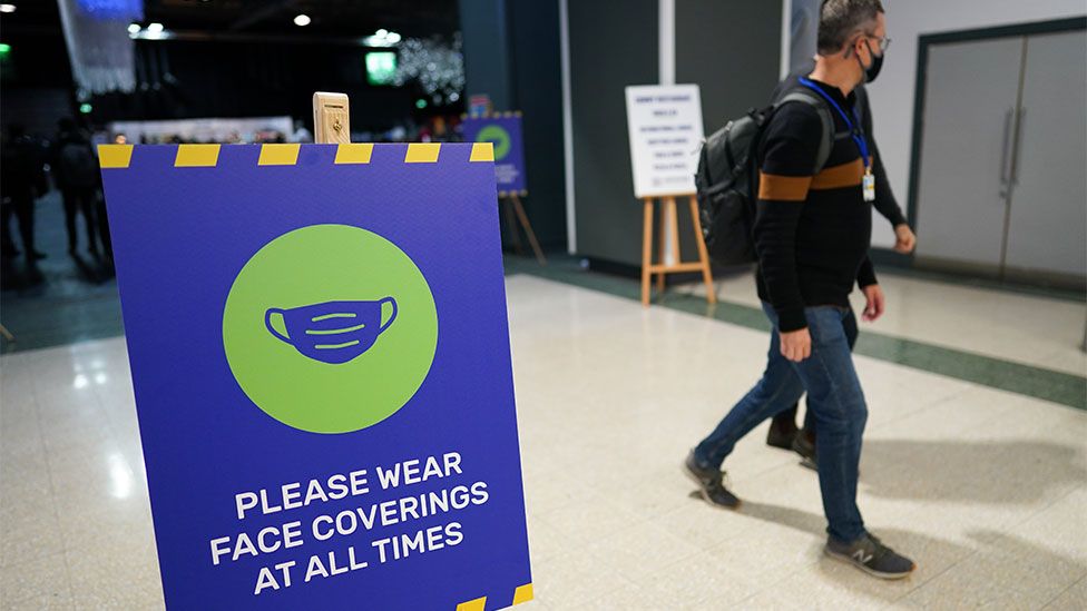 Covid-19 protection measures sign at the COP26 climate change conference in Glasgow