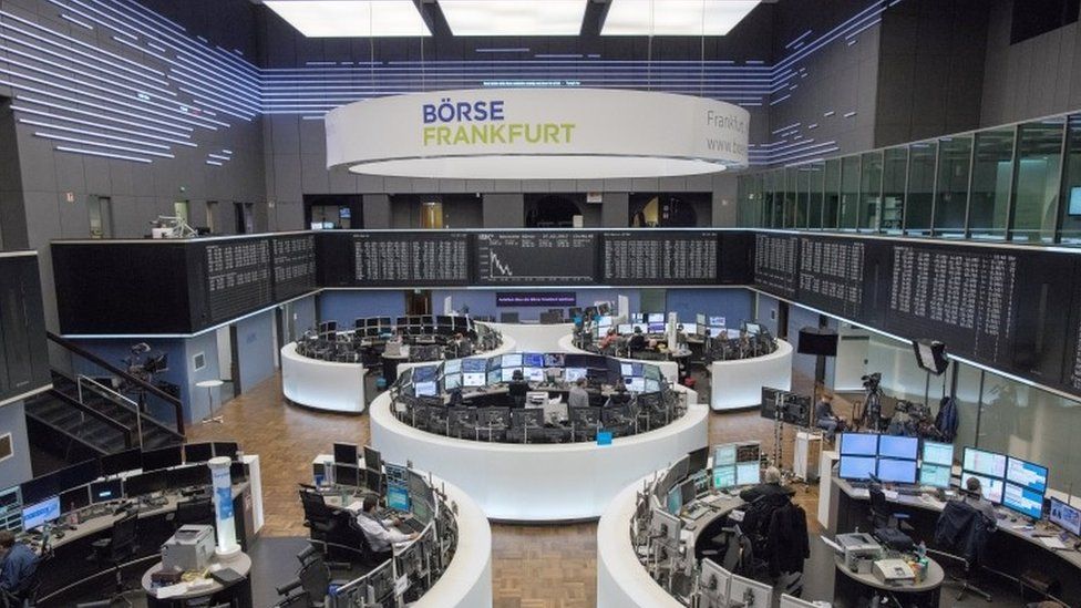 Traders work on the floor of the stock exchange in Frankfurt am Main, Germany, 27 February 2017