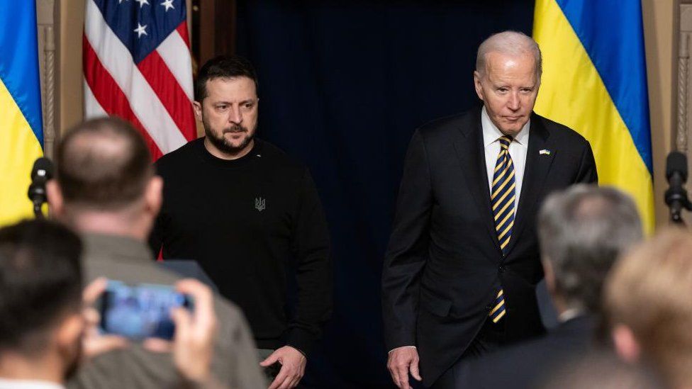 US President Joe Biden (R) and Ukrainian President Volodymyr Zelensky (L) enter the room to hold a joint news conference in the Indian Treaty Room of the Eisenhower Executive Office Building, on the White House complex in Washington, DC, USA, 12 December 2023