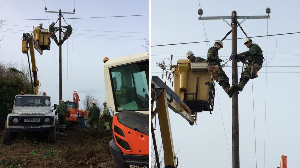 Scottish Power engineers work to restore power lines in Anglesey
