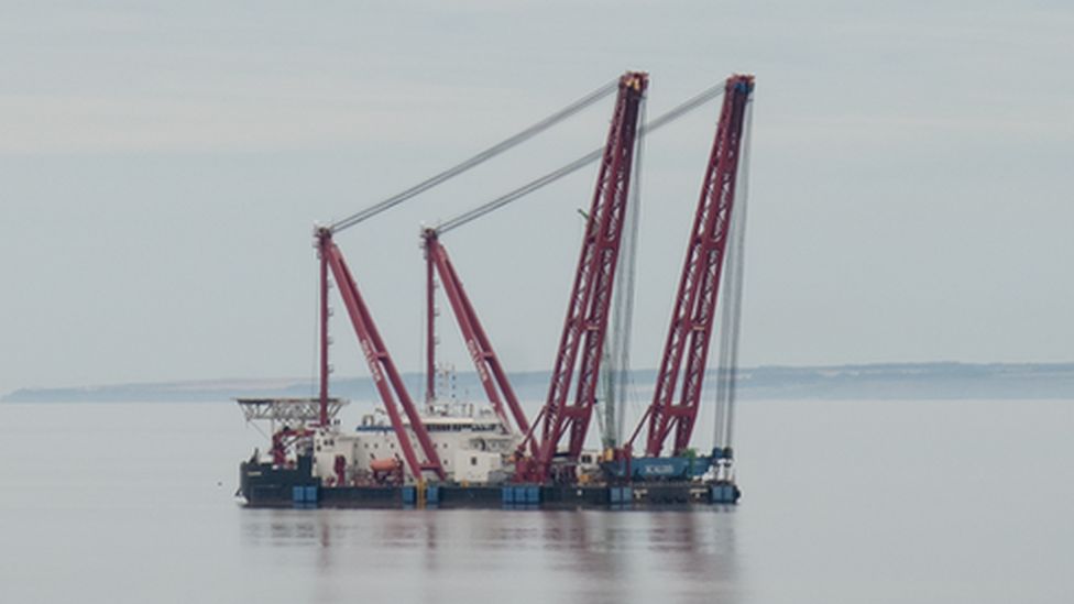 Floating crane platform in water