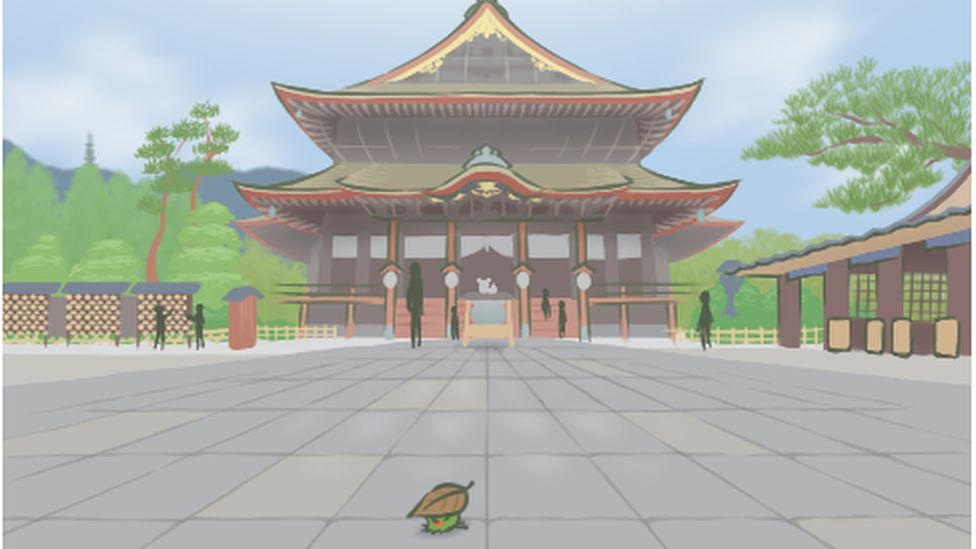 A frog poses in front of a temple