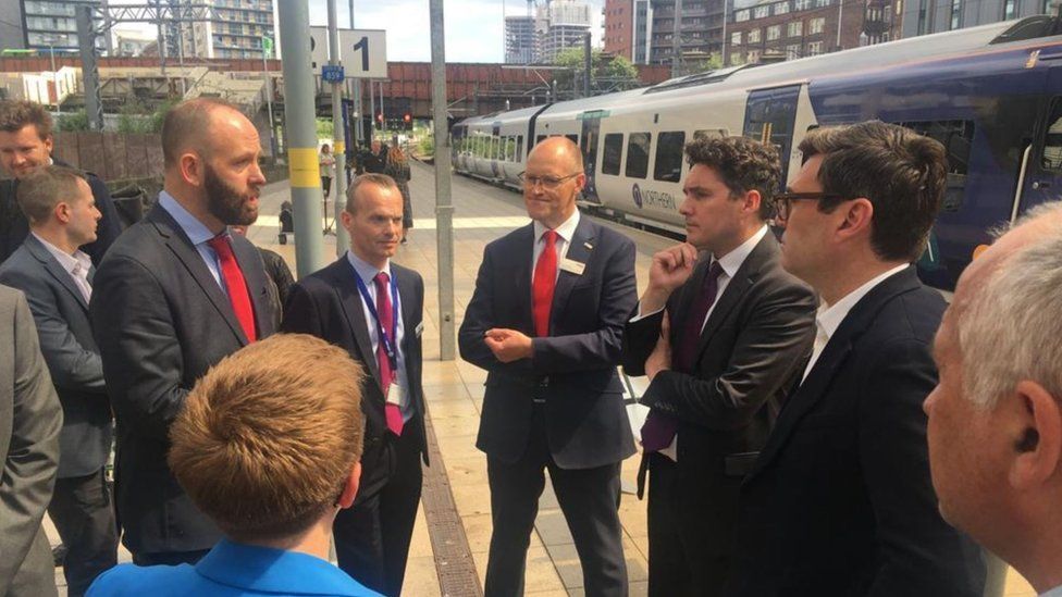 Rail minister Huw Merriman at Manchester Victoria station