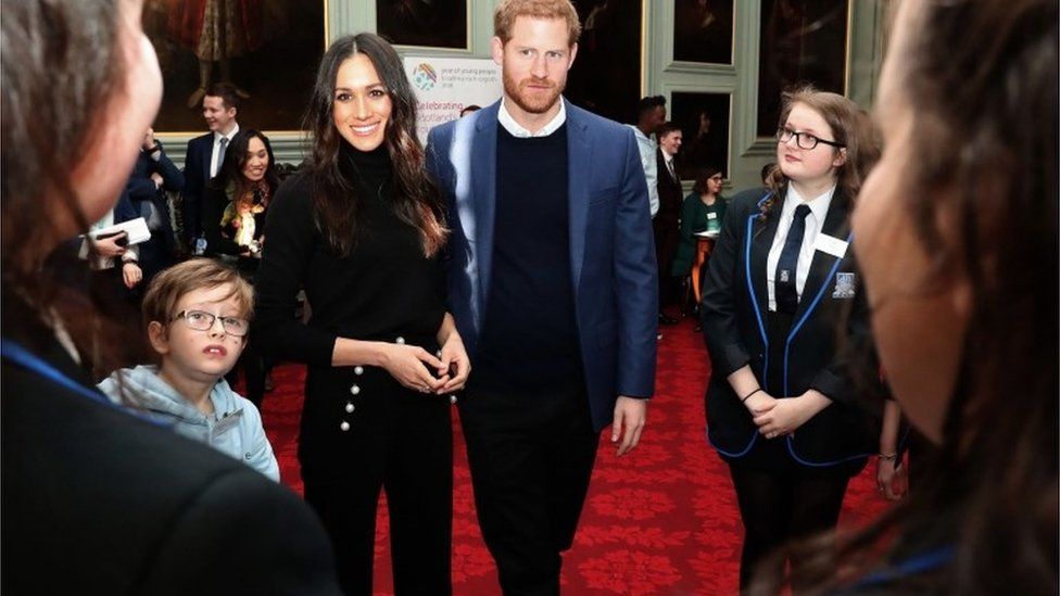 Prince Harry and Meghan Markle attend a reception for young people in the Palace of Holyroodhouse in Edinburgh