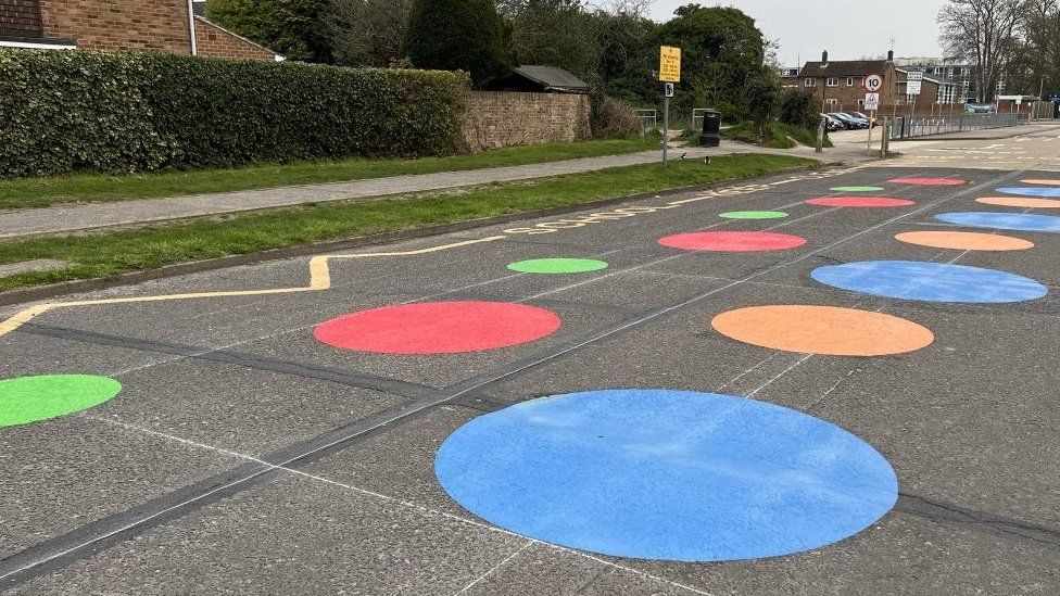 Spots on a road near a school