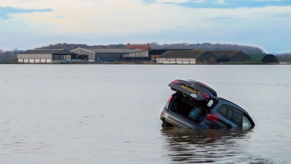 Car floating in flood water in Lincolnshire