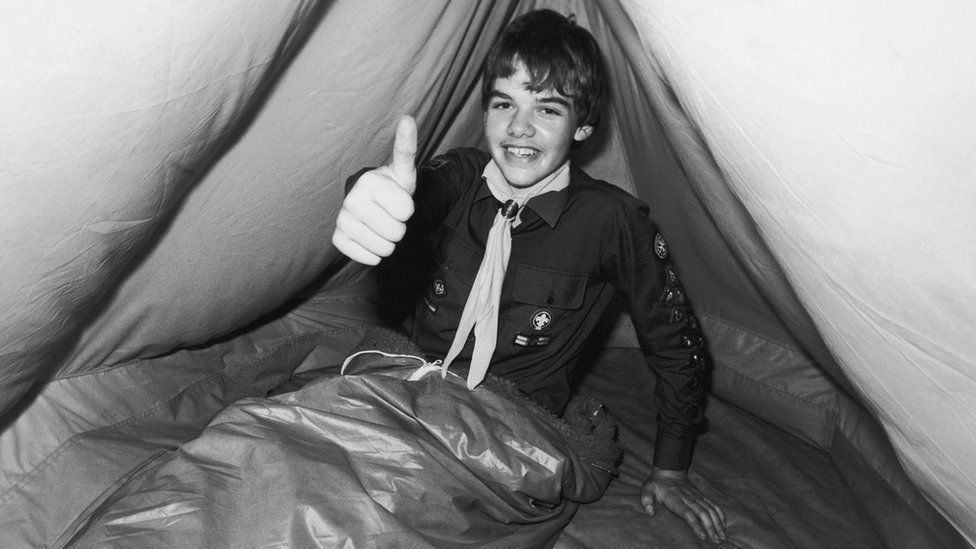 A scout in a tent in the 1980s