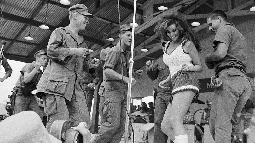 Welch dances in Vietnam with soldiers