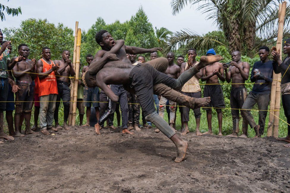 Members of Uganda's Soft Ground Wrestling battle during a training session at their camp in Mukono on February 28, 2024.