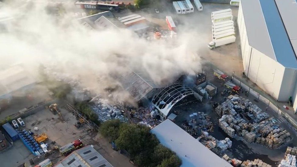 Smoke coming from a fire at a recycling factory in Corby