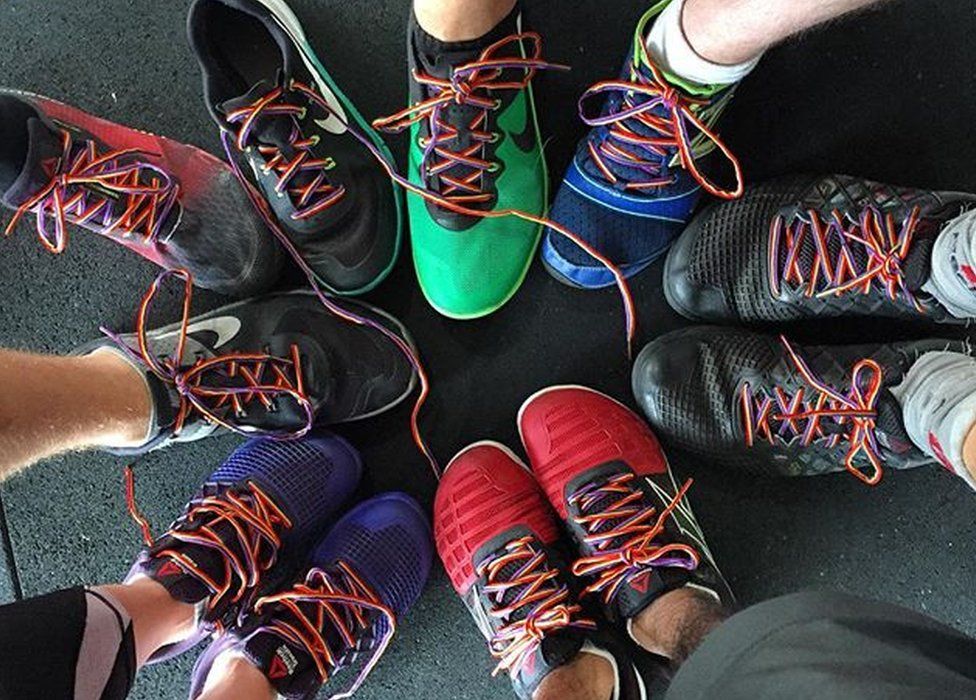 Rainbow laces decorate shoes as part of a campaign against homophobia