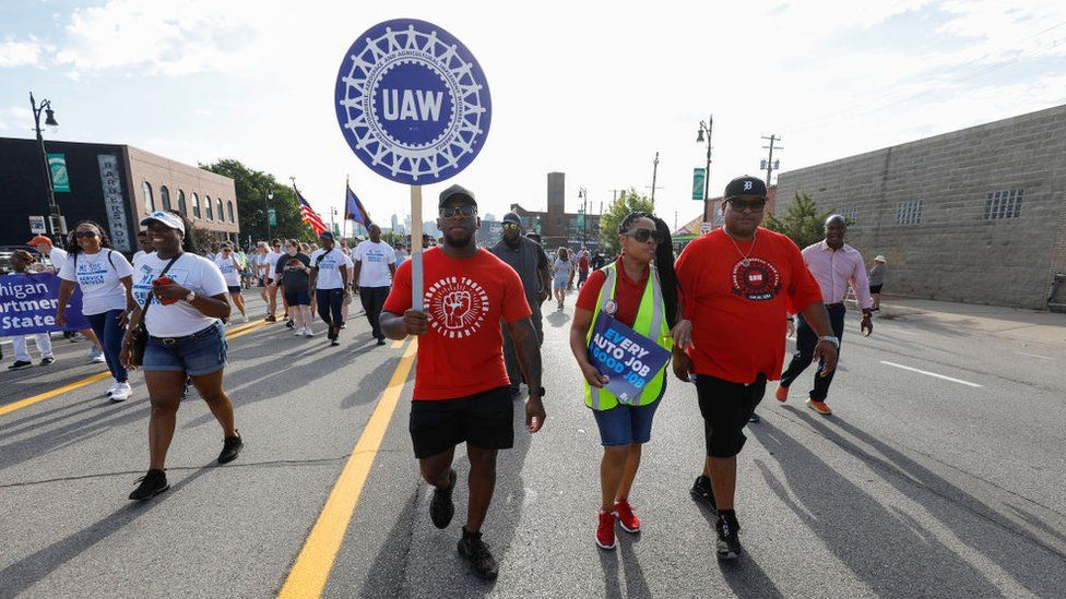 United Auto Workers members march in the Detroit Labor Day Parade on September 4, 2023 in Detroit, Michigan.