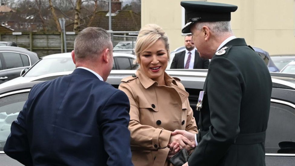 Michelle O'Neill and Jon Boutcher shook hands as she arrived at Garnerville