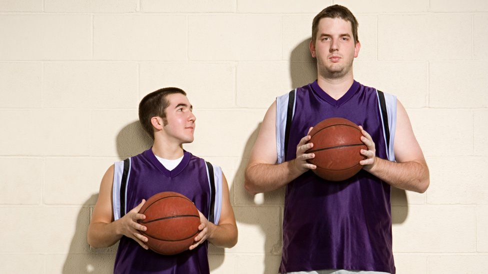 Small and tall basketball players