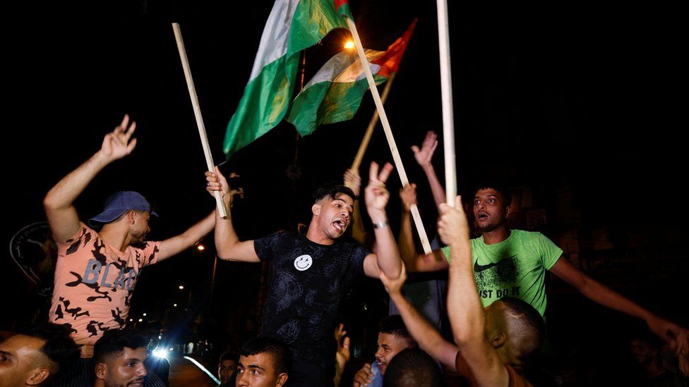 Image shows Palestinians celebrating