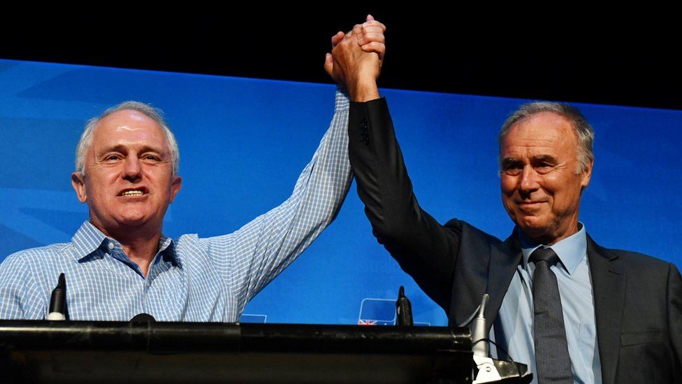 Prime Minister Malcolm Turnbull and newly re-elected Liberal member for Bennelong John Alexander celebrate at the by-election night party at the West Ryde Leagues Club in Sydney, Australia, on 16 December 2017