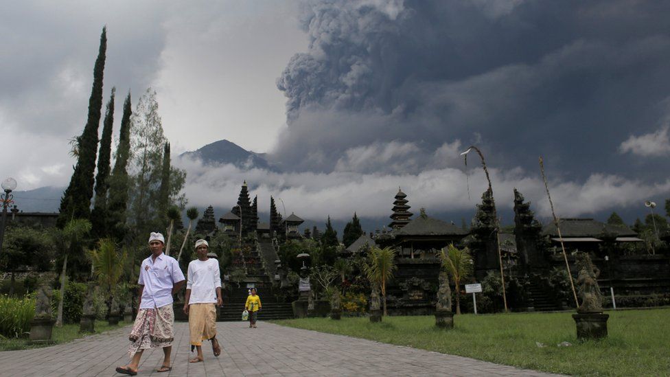 Mount Agung volcano erupts as seen from Besakih Temple in Karangasem