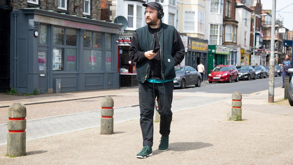 Sound artist Oliver Payne on King Street in Great Yarmouth