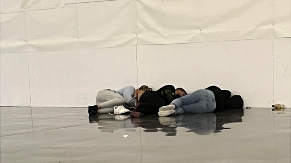 People sleeping on floor