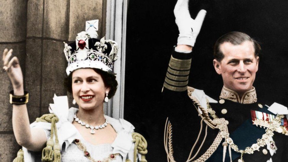 Queen Elizabeth II and the Duke of Edinburgh on the day of their coronation, Buckingham Palace, 1953. (Colorised black and white print). Artist Unknown. (Photo by The Print Collector/Getty Images)