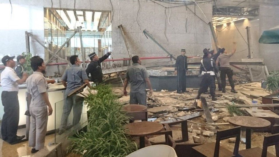 Staff inspect damage at the stock exchange