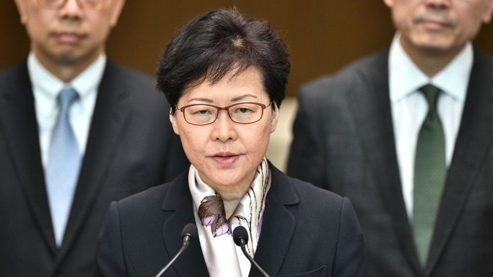 Hong Kong Chief Executive Carrie Lam (C) speaks during a press conference in Hong Kong on August 5, 2019