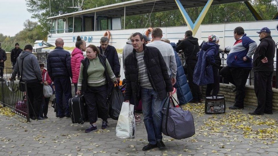 Kherson residents leave a boat after crossing to the left (eastern) bank of the Dnipro river. Photo: October 2022