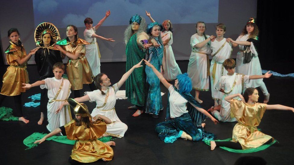Children on stage in classical costumes at Best Theatre Arts