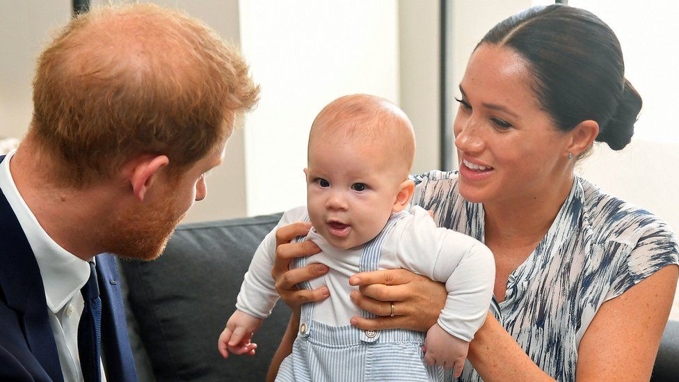 The Duke and Duchess of Sussex holding their son Archie during a meeting with Archbishop Desmond Tutu and Mrs Tutu at their legacy foundation in Cape Town