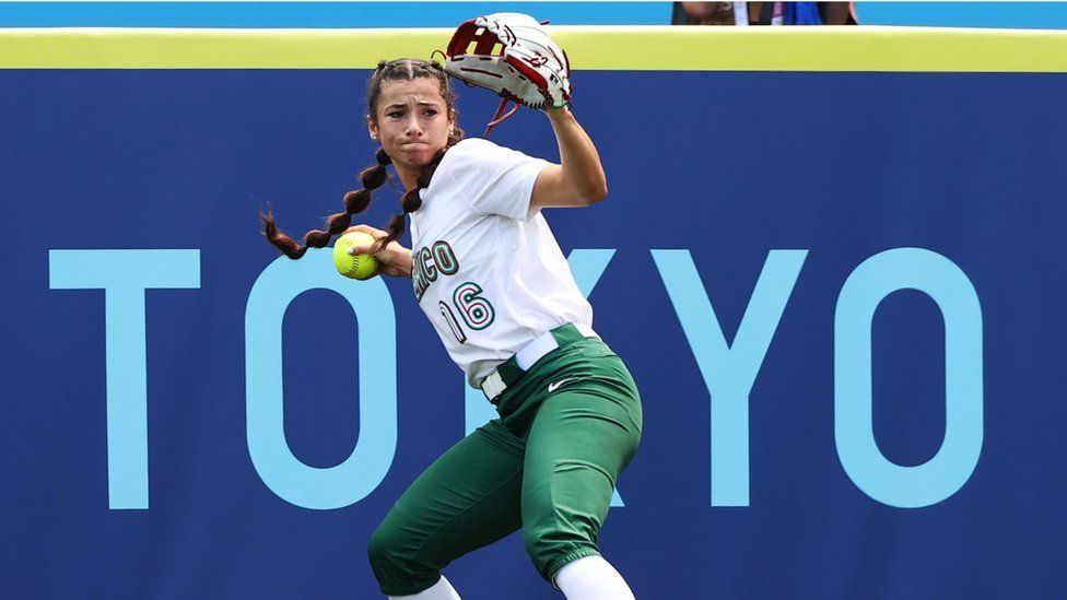 A Mexican player throws the ball during the opening match against Japan