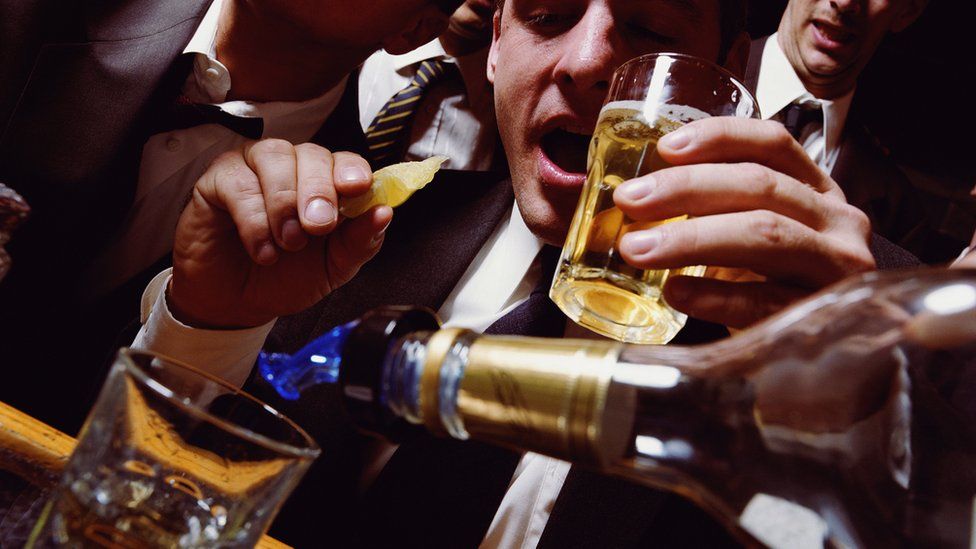 Stock image of men drinking
