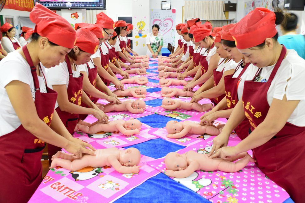 People participate in a free infant care training course organized by local labour union in Haikou, Hainan province, China, 19 July 2017.