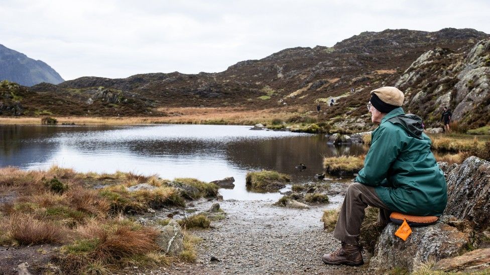 Andrew Nichol sitting by Innominate Tarn