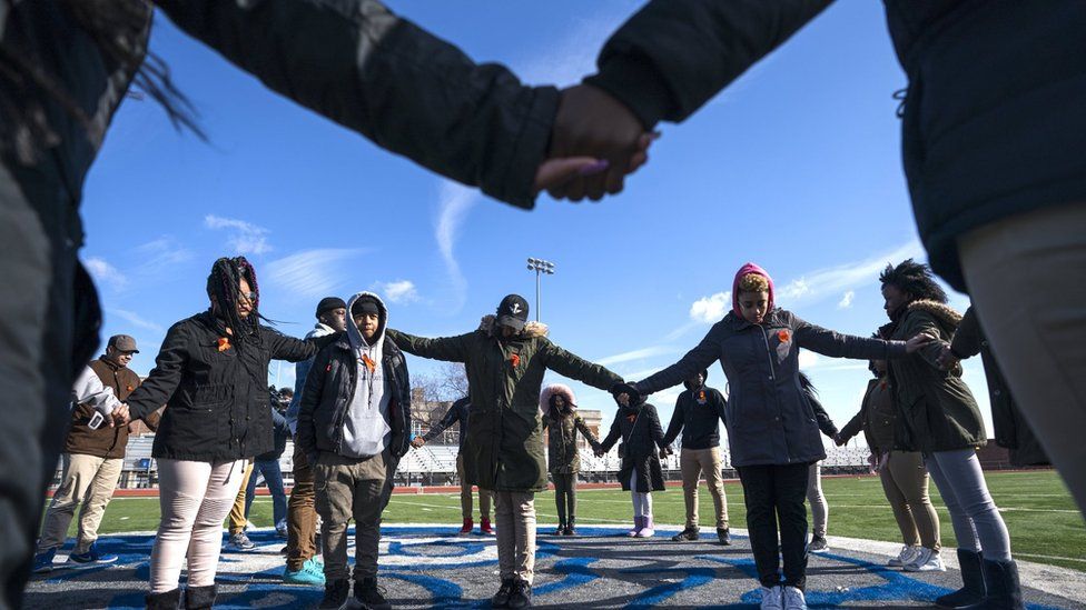 Eastern High School students walk out of class and assemble on their football field for the National School Walkout, in Washington, DC, 14 March 2018.