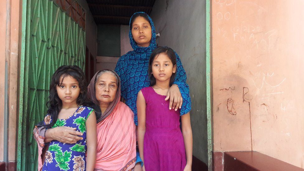 Sonia Akther with her two daughters and a Mr Chowkidar's mother