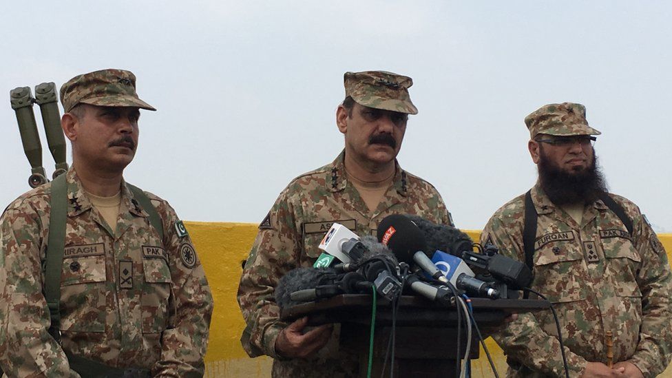 Members of the Pakistan military speak at a press conference event near the LOC area.