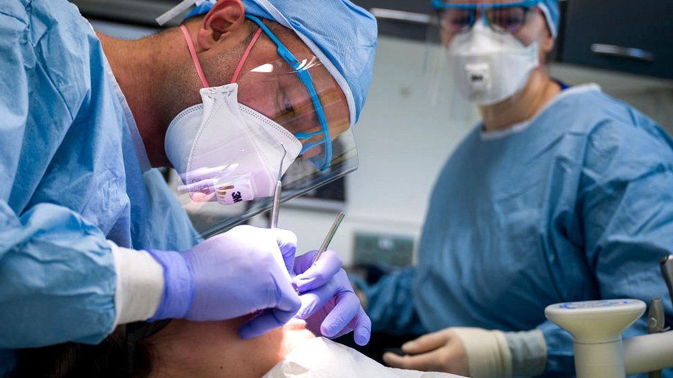 Patient receiving dental treatment