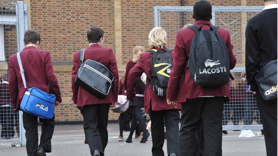 Secondary pupils walking into school
