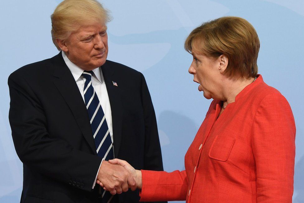 German Chancellor Angela Merkel greets US President Donald Trump in Hamburg, 7 July