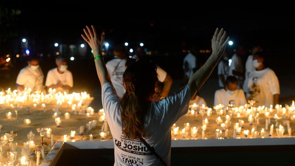 Members of Synagogue Church of All Nations (SCOAN) hold a candlelight procession for TB Joshua in Lagos, Nigeria - Monday 5 July 2021