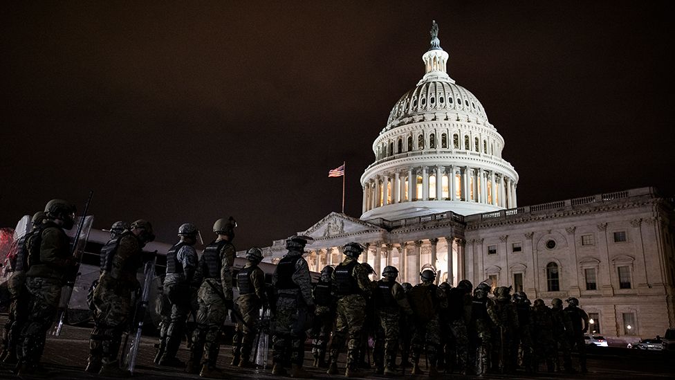 Members of the National Guard and the Washington D.C. police stand guard to keep demonstrators away from the U.S. Capitol - 6 January 2021